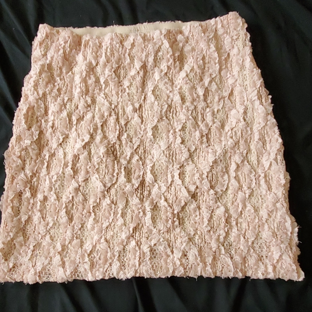 Above knee, cute stitched skirt.